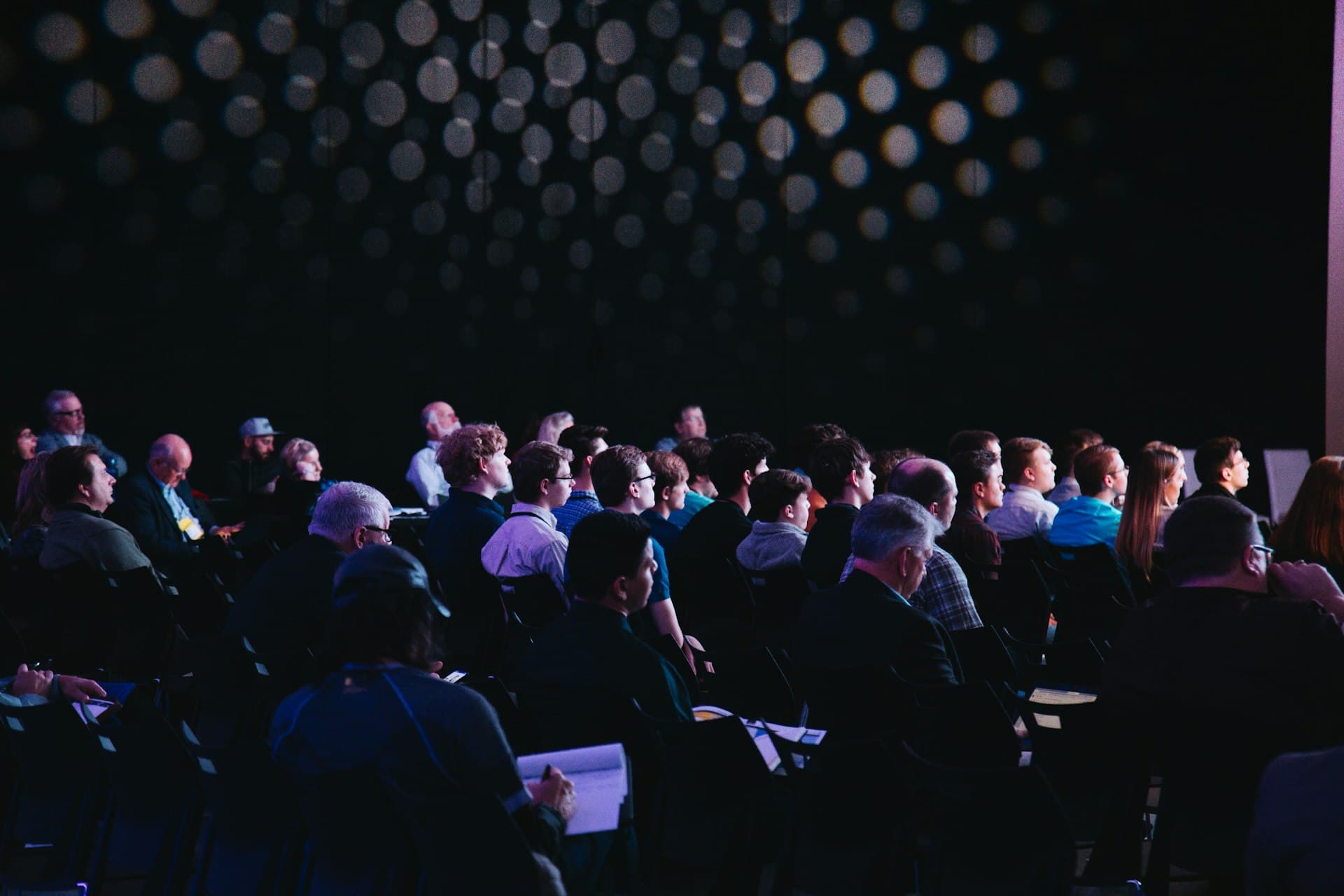 Audience seated at a corporate presentation